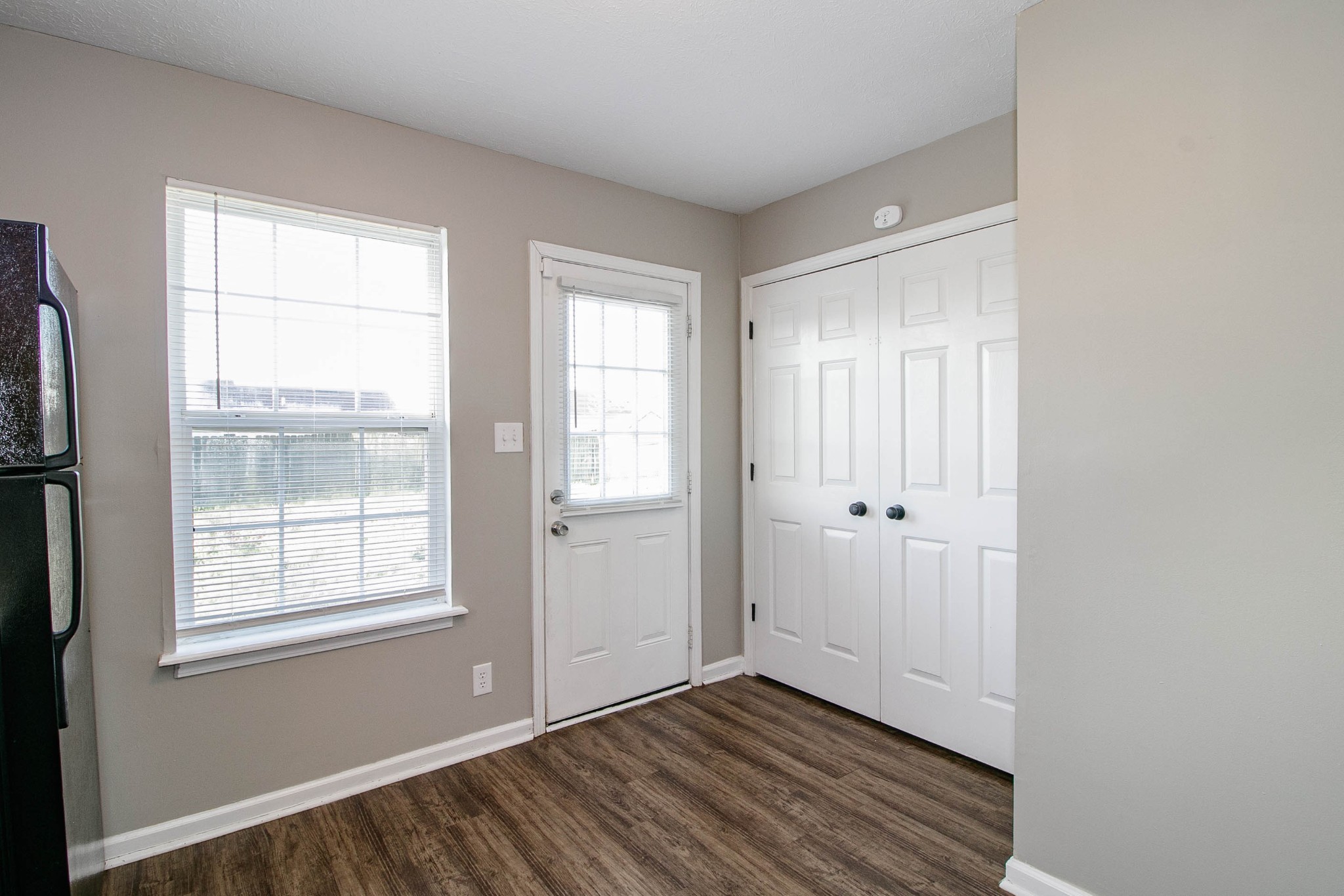947 State Line Road Oak Grove, KY 42262 - Photo 9 of 25 a view of an empty room with wooden floor and a window