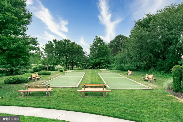 a view of a swimming pool with a yard