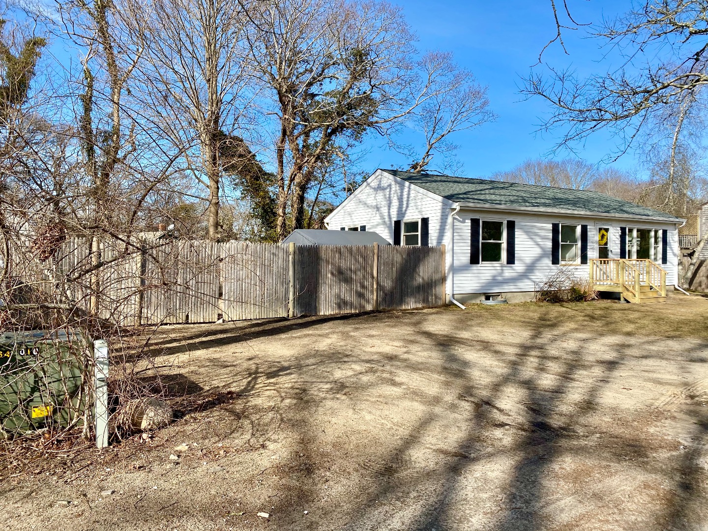 14 Rogers Farm Road Vineyard Haven, MA 02568 - Photo 1 of 12 a front view of a house with a yard