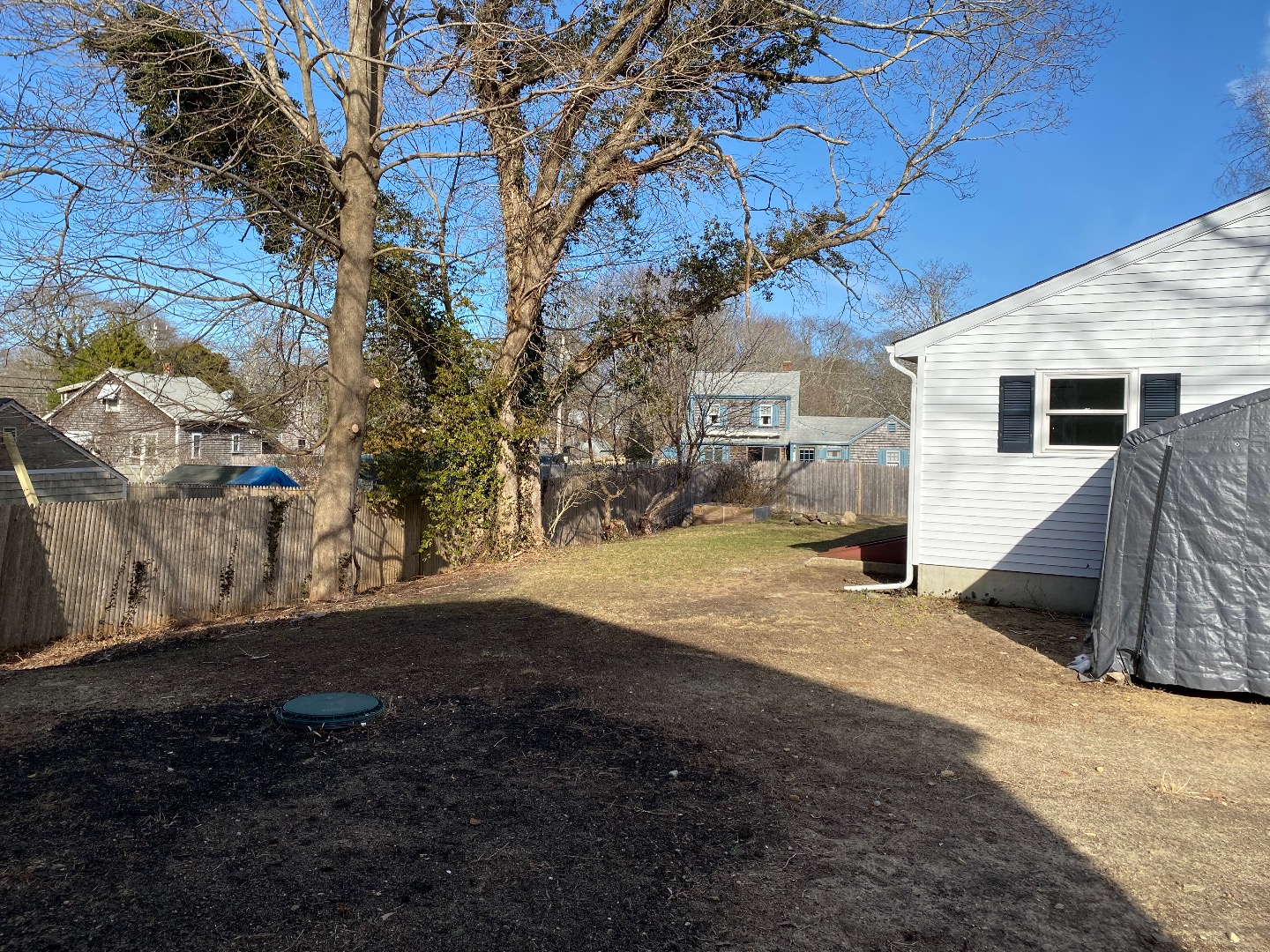 14 Rogers Farm Road Vineyard Haven, MA 02568 - Photo 11 of 12 a view of a backyard with large trees
