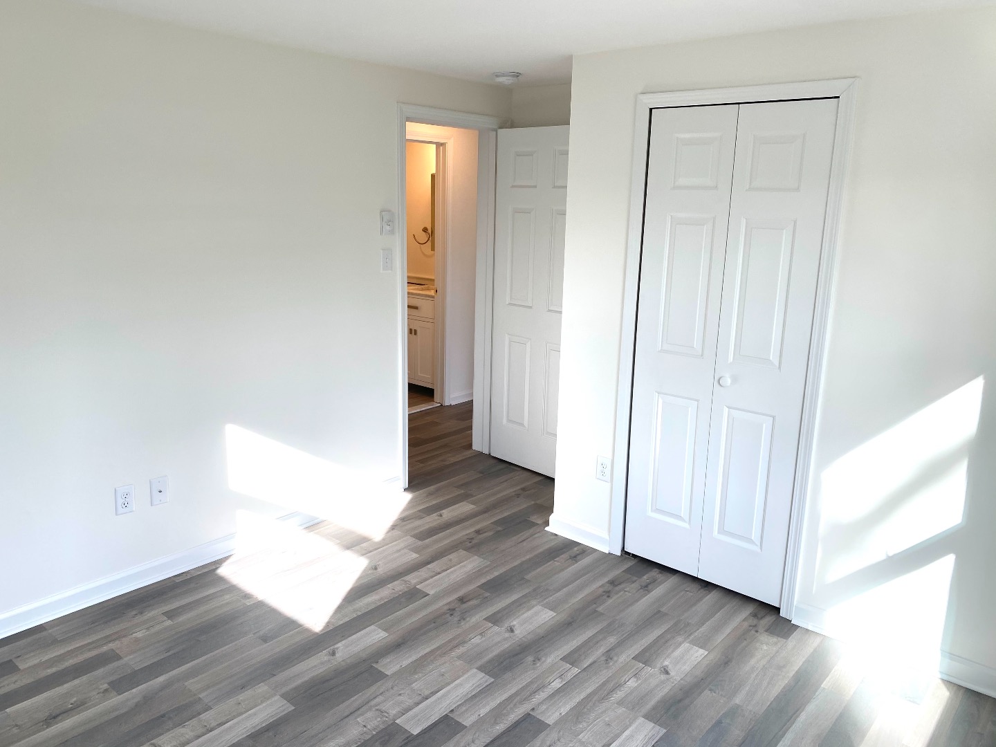 14 Rogers Farm Road Vineyard Haven, MA 02568 - Photo 9 of 12 an empty room with wooden floor and windows