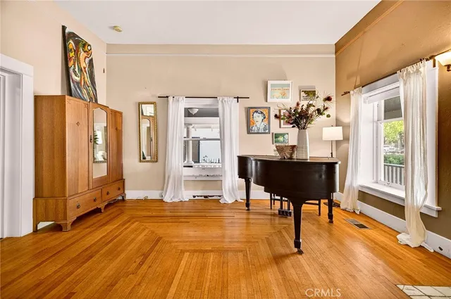 a view of a livingroom with furniture and hardwood floor