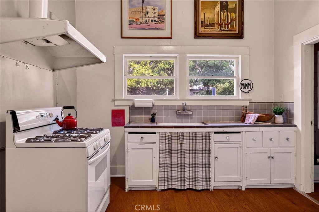 1050 Esplanade Chico, CA 95926 - Photo 14 of 42 a kitchen with stainless steel appliances white cabinets and a window