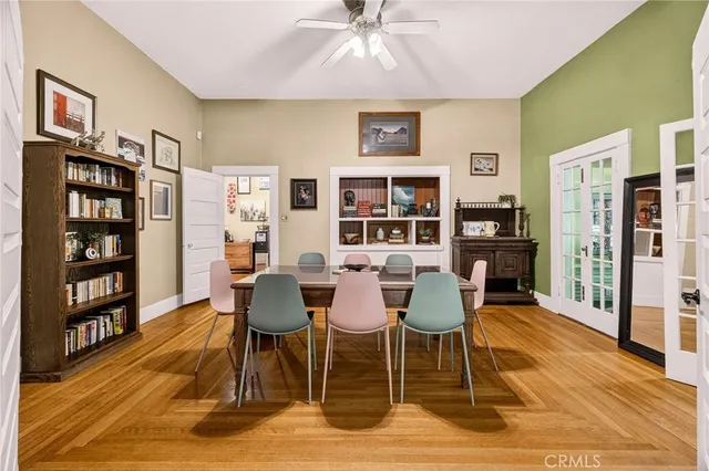 a dining room with furniture and wooden floor
