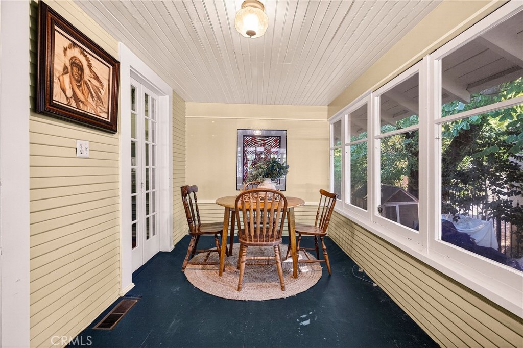 1050 Esplanade Chico, CA 95926 - Photo 19 of 42 a dining room with furniture a rug and wooden floor