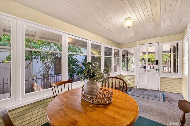 a view of a dining room with furniture wooden floor and chandelier