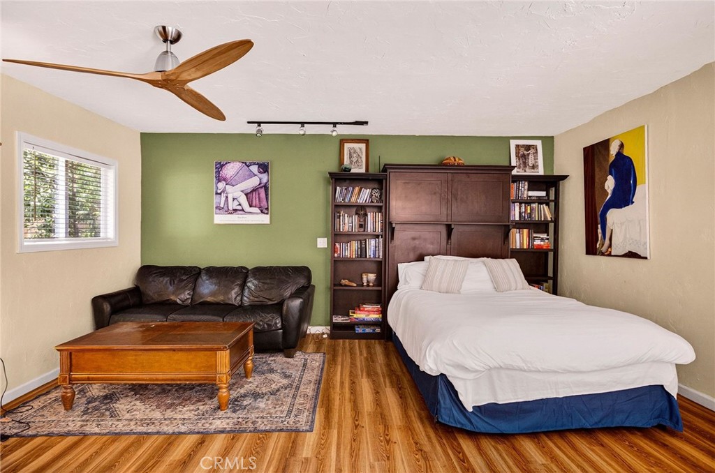 1050 Esplanade Chico, CA 95926 - Photo 32 of 42 a bedroom with a bed and wooden floor