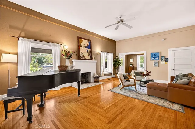 a living room with furniture a fireplace and a table