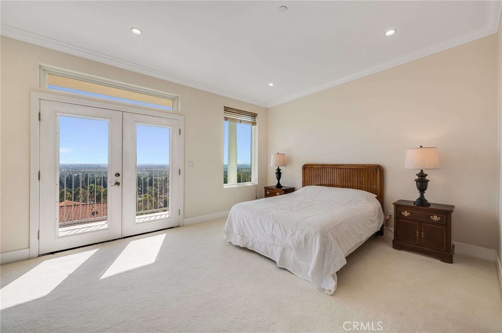 11837 Rideout Way Whittier, CA 90601 - Photo 22 of 44 a bedroom with a bed and a large window