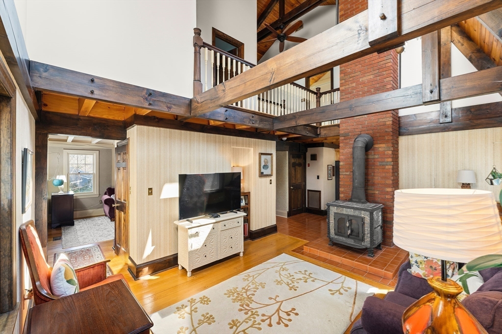 55 Boyles Street Beverly, MA 01915 - Photo 11 of 30 a living room with furniture and a flat screen tv