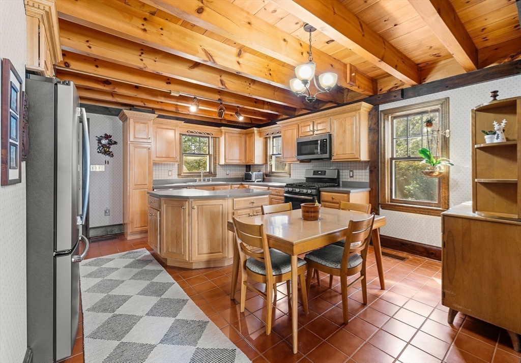 55 Boyles Street Beverly, MA 01915 - Photo 12 of 30 a kitchen with stainless steel appliances granite countertop a sink and a refrigerator