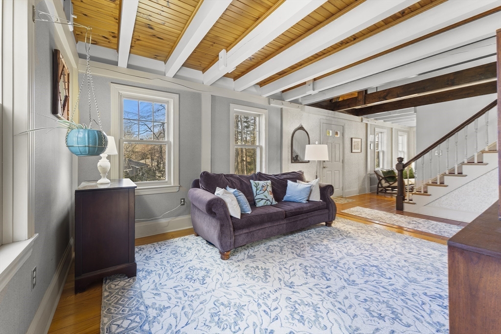 55 Boyles Street Beverly, MA 01915 - Photo 18 of 30 a living room with furniture and a large window