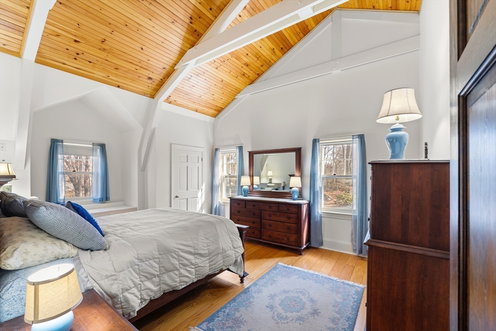 55 Boyles Street Beverly, MA 01915 - Photo 20 of 30 a bedroom with a bed and a dresser