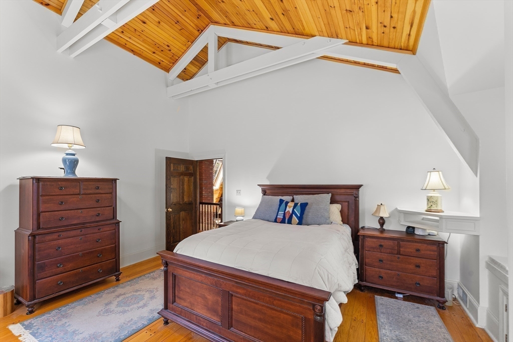 55 Boyles Street Beverly, MA 01915 - Photo 22 of 30 a bed room with a bed and a dresser