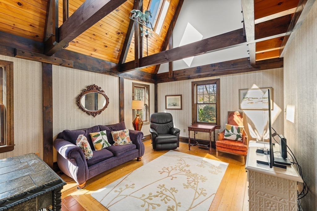 55 Boyles Street Beverly, MA 01915 - Photo 9 of 30 a living room with furniture a rug and a wall painting