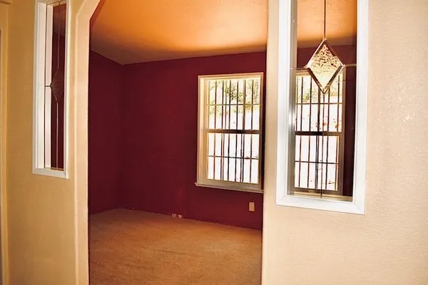 an empty room with windows