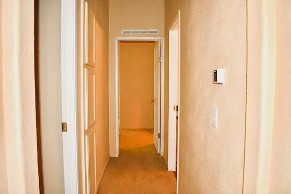 a view of a bathroom from a hallway