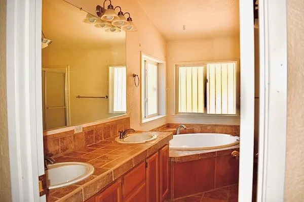 a bathroom with a tub and shower