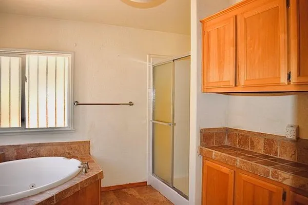 a bathroom with a toilet and a shower curtain