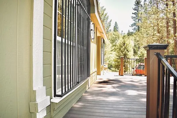 a view of balcony with wooden floor
