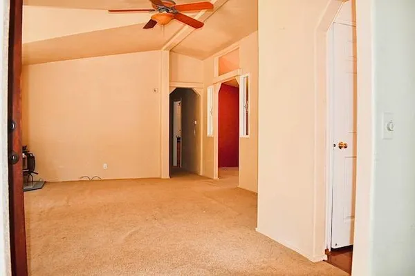 a view of a room with a hallway