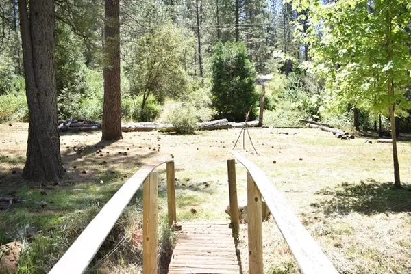 a view of a yard covered with snow in the background