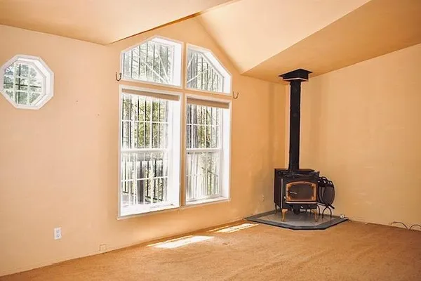 a view of a livingroom with furniture and a window