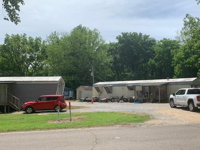 1585 Asbury Glimp Road Ripley, TN 38063 - Photo 3 of 11 a view of house with outdoor space and car parked