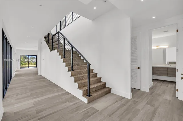 a bathroom with a sink vanity and a mirror