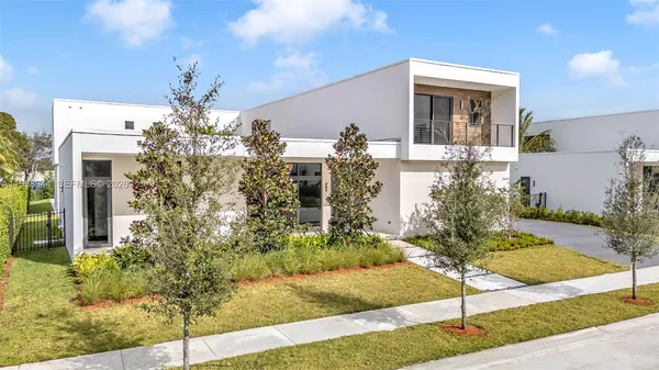 a front view of a house with yard