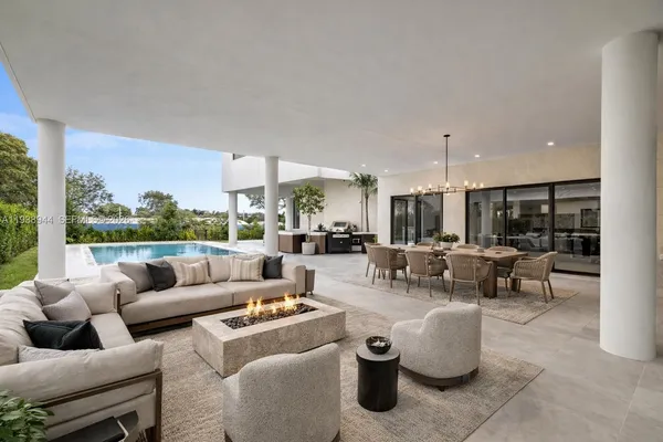 a view of a balcony next to a yard