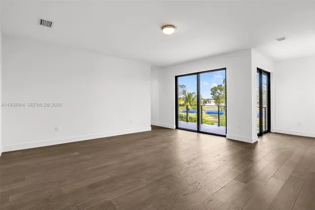 a bathroom with a large tub and sink