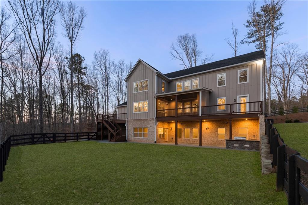 15448 Hopewell Road Milton, GA 30004 - Photo 105 of 125 a front view of a house with a garden