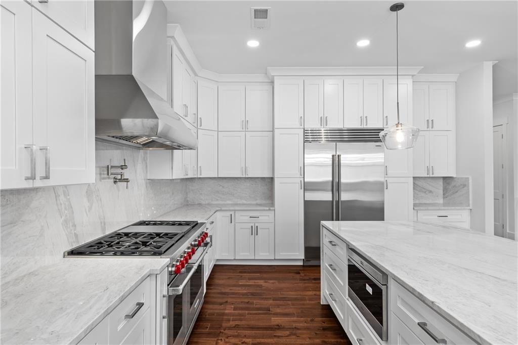 15448 Hopewell Road Milton, GA 30004 - Photo 24 of 125 a kitchen with stainless steel appliances granite countertop a sink stove and refrigerator