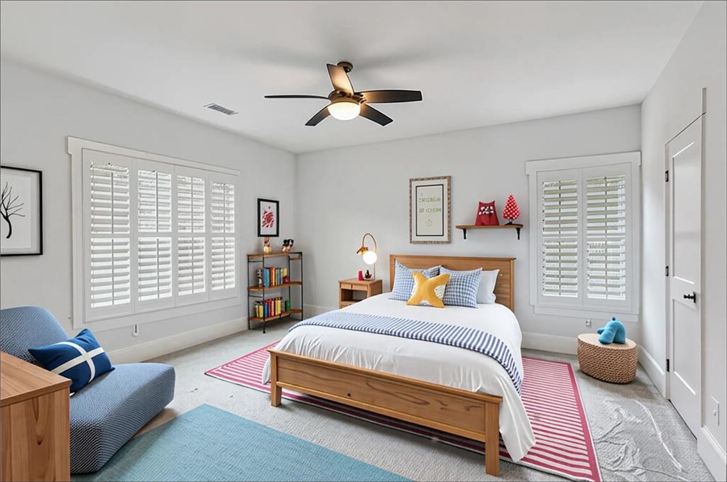 15448 Hopewell Road Milton, GA 30004 - Photo 60 of 125 a bedroom with a bed a couch and a window
