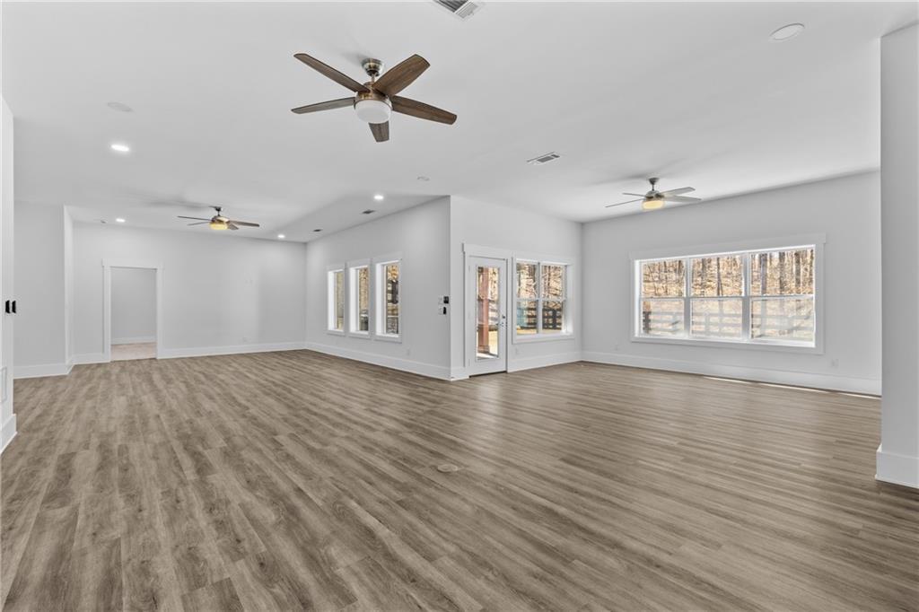 15448 Hopewell Road Milton, GA 30004 - Photo 66 of 125 wooden floor in an empty room with a window