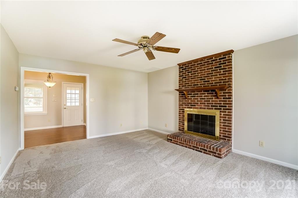 10101 Deer Spring Lane Charlotte, NC 28210 - Photo 23 of 45 a view of empty room with fireplace and fan