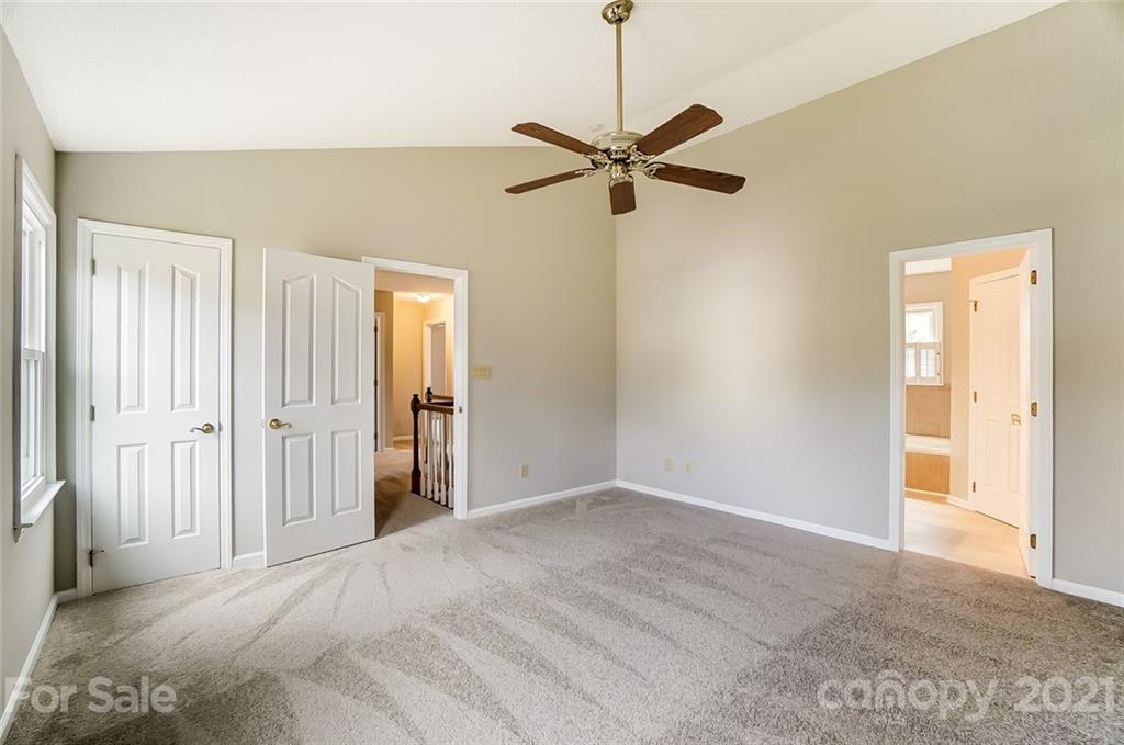 10101 Deer Spring Lane Charlotte, NC 28210 - Photo 26 of 45 a view of a room with a ceiling fan and closet area