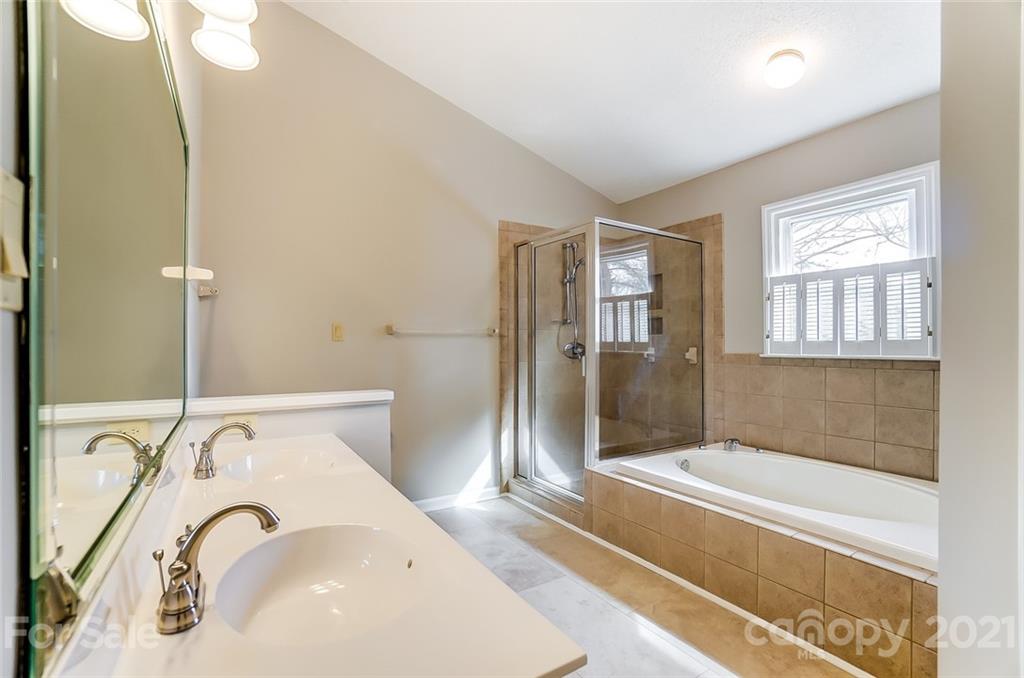 10101 Deer Spring Lane Charlotte, NC 28210 - Photo 27 of 45 a bathroom with a bathtub and a sink
