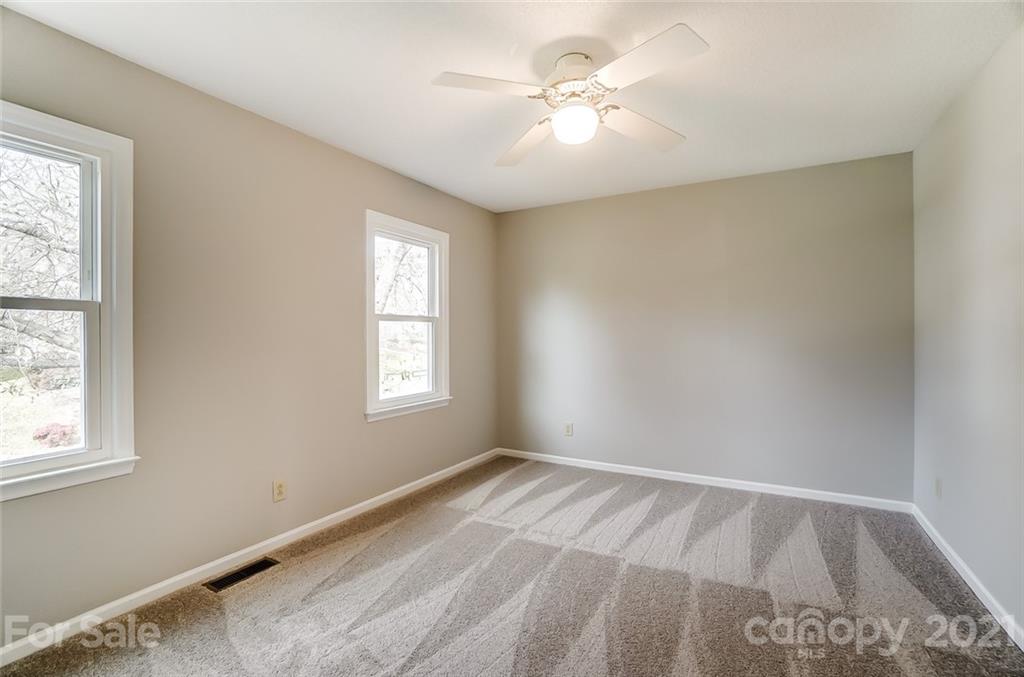 10101 Deer Spring Lane Charlotte, NC 28210 - Photo 30 of 45 a view of an empty room with a window