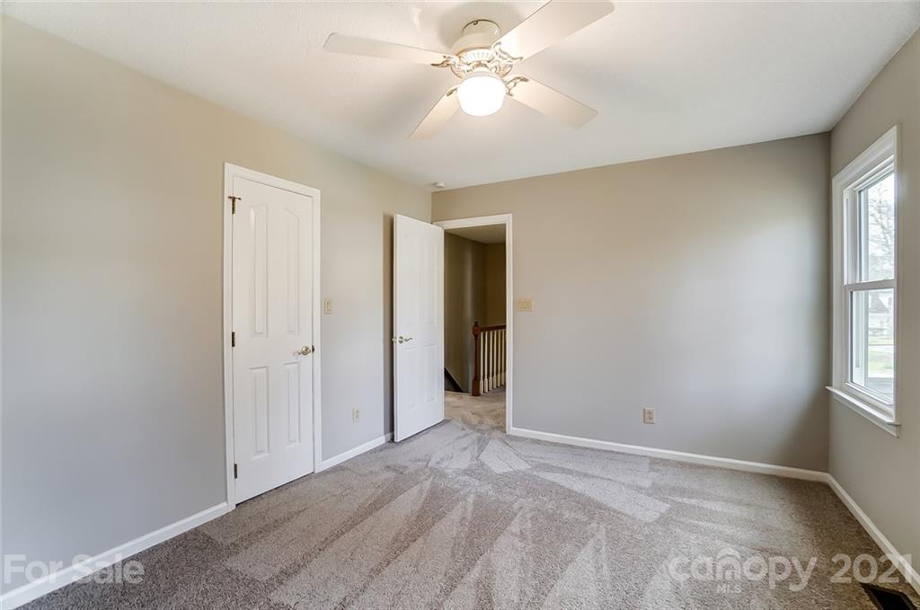 10101 Deer Spring Lane Charlotte, NC 28210 - Photo 31 of 45 wooden floor in an empty room with a window