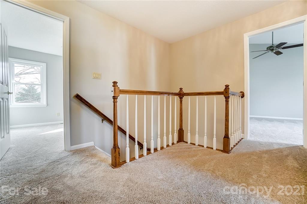 10101 Deer Spring Lane Charlotte, NC 28210 - Photo 32 of 45 a view of a hallway with staircase