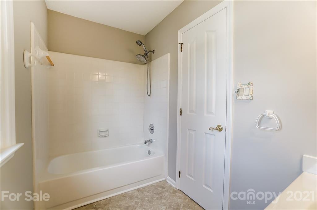 10101 Deer Spring Lane Charlotte, NC 28210 - Photo 36 of 45 a bathroom with a bathtub and a shower