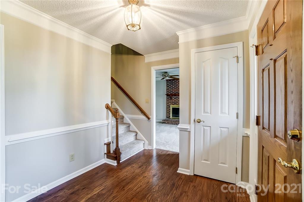 10101 Deer Spring Lane Charlotte, NC 28210 - Photo 5 of 45 a view of entryway with stairs and wooden floor