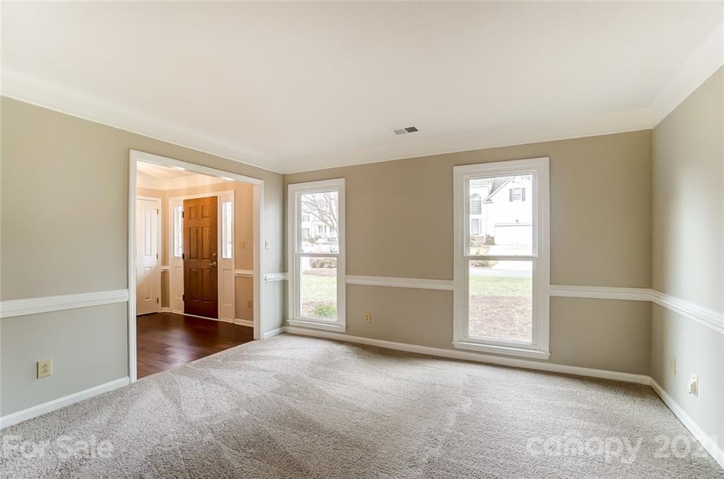 10101 Deer Spring Lane Charlotte, NC 28210 - Photo 6 of 45 an empty room with windows and closet