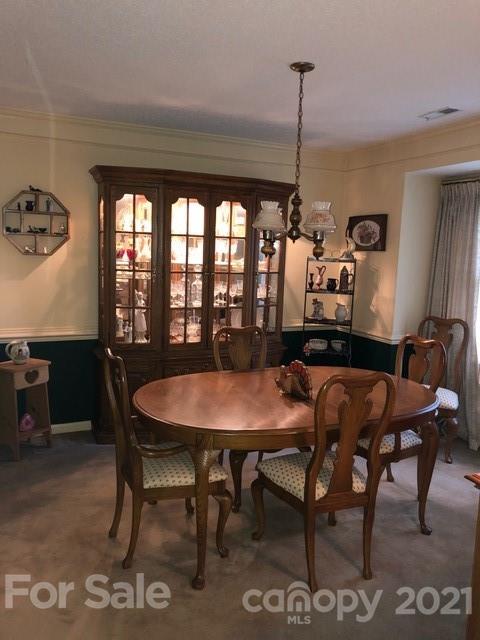 10101 Deer Spring Lane Charlotte, NC 28210 - Photo 10 of 45 a dining room with furniture and window