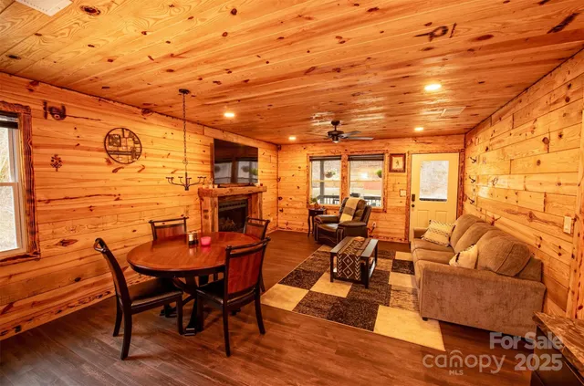 a dining room with furniture and wooden floor