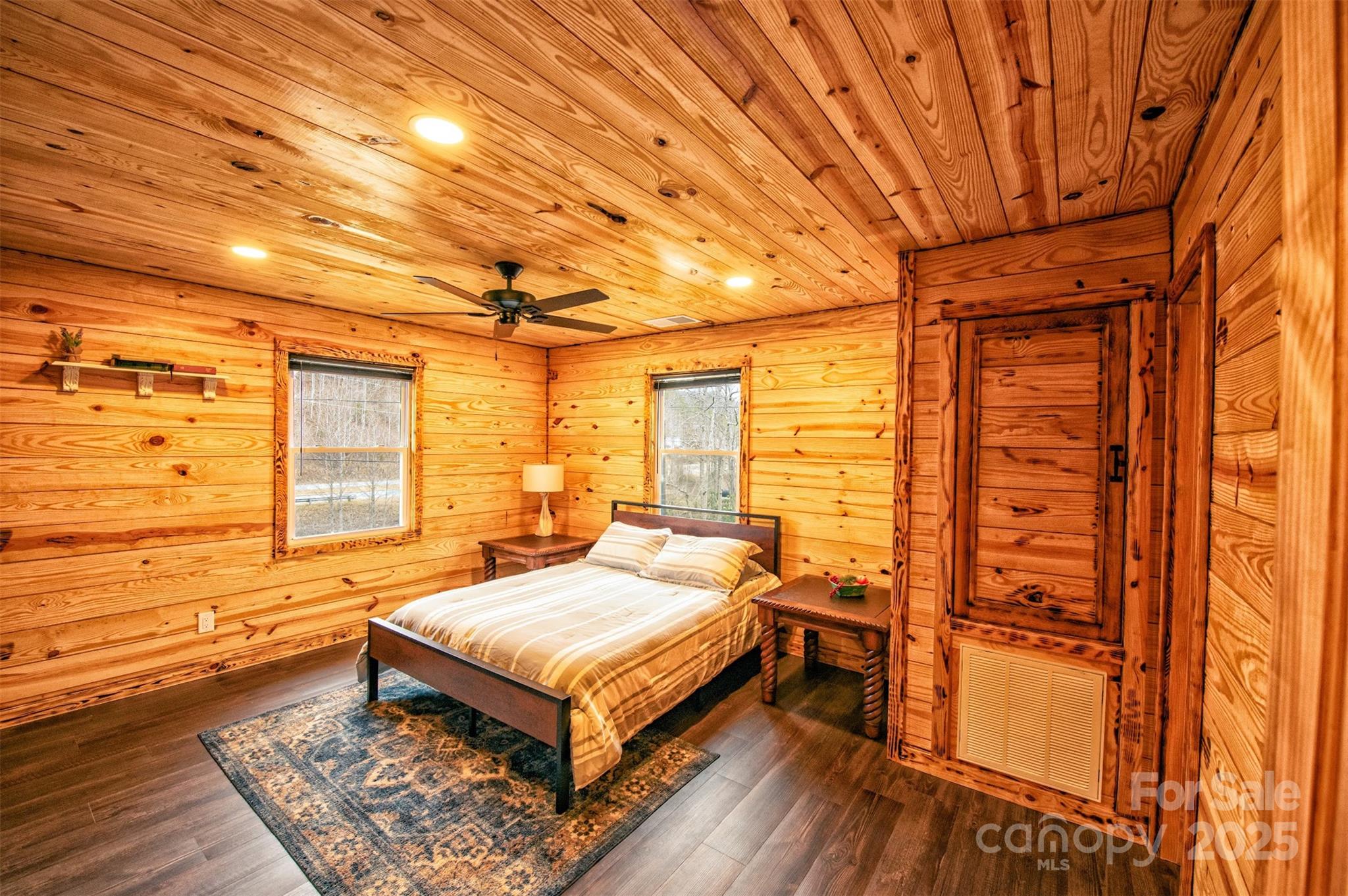 23 Honeysuckle Ridge Almond, NC 28702 - Photo 16 of 21 a bedroom with furniture and large window