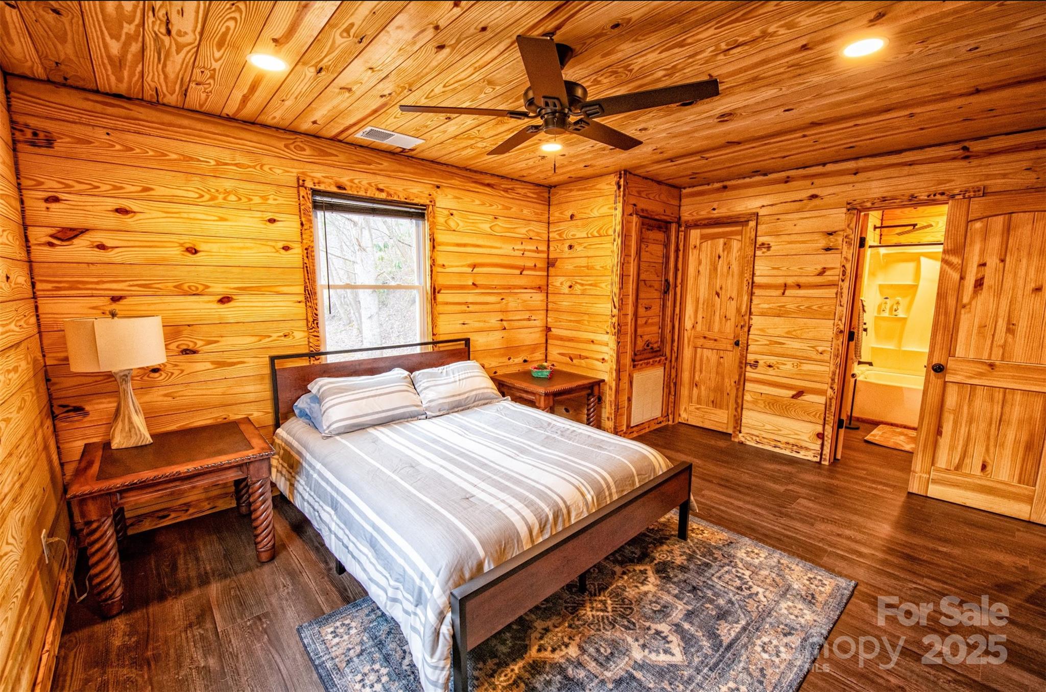 23 Honeysuckle Ridge Almond, NC 28702 - Photo 17 of 21 a bedroom with a bed and wooden floor