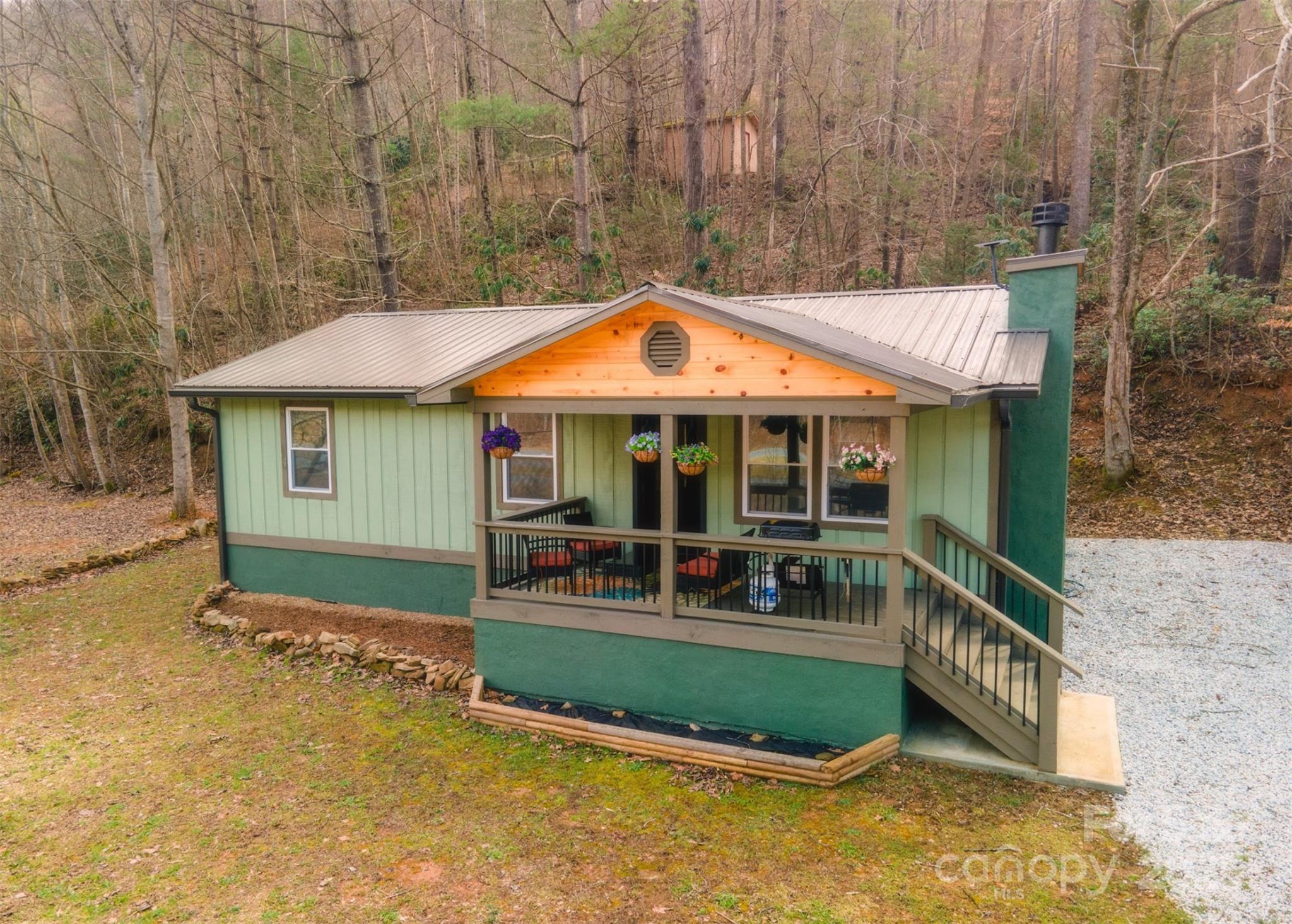 23 Honeysuckle Ridge Almond, NC 28702 - Photo 4 of 21 a front view of a house with porch